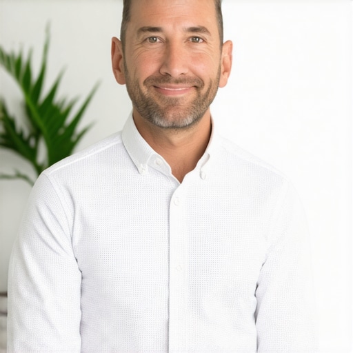 Business owner working on computer with GMB dashboard, optimizing local search rankings.